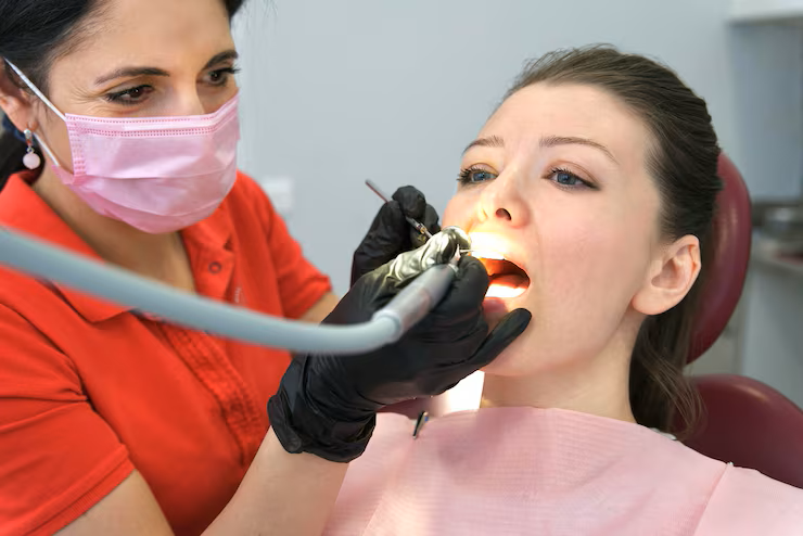 dentist examining tooth after root canal
