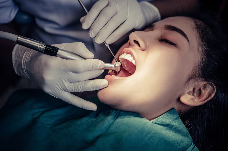 dentist performing root canal treatment